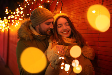 Happy couple spending time at Christmas fair