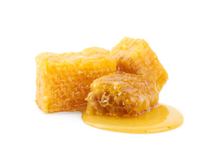 Pieces of tasty fresh honeycomb isolated on whiteの写真素材