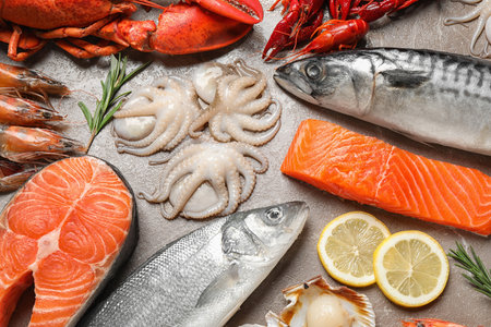 Fresh fish and seafood on marble table, flat layの写真素材