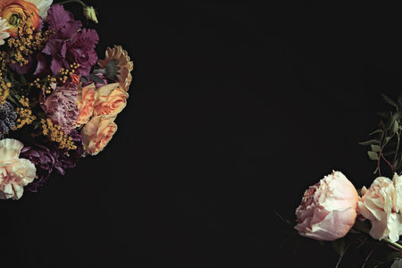 Beautiful bouquet of different flowers on black background, space for text. Floral card design with dark vintage effectの写真素材