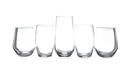 Set of different clean empty glasses isolated on whiteの写真素材