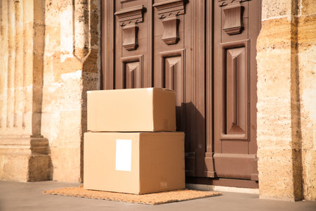 Delivered parcels on door mat near entrance