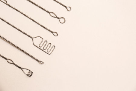 Set of logopedic probes for speech therapy on beige background, flat lay. Space for textの写真素材