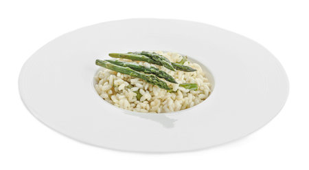 Delicious risotto with asparagus isolated on whiteの写真素材
