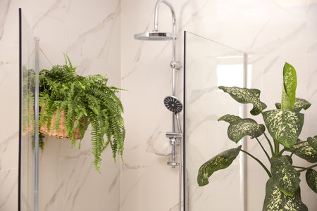 Beautiful green plants in elegant modern bathroom. interior design