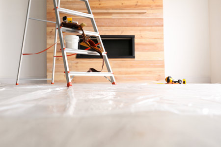 Stepladder and different tools in the room. interior renovation