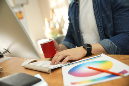 Professional designer working with computer in office, closeupの写真素材