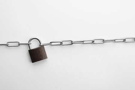 Steel padlock and chain isolated on white, top view. safety concept