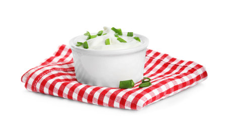 Fresh sour cream with onion and fabric on white backgroundの写真素材