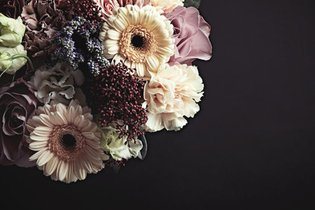 Beautiful bouquet on black background. Floral card design with dark vintage effectの写真素材