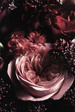 Beautiful bouquet of different flowers, closeup. Floral card design with dark vintage effectの写真素材