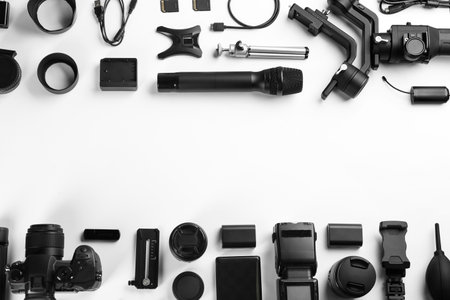 Composition with camera and video production equipment on white background, top view with space for textの写真素材