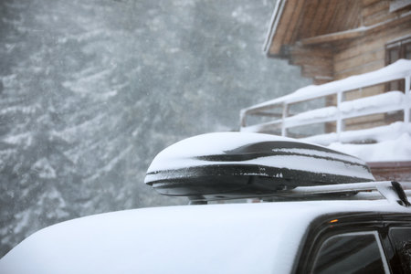 Modern car covered in snow outdoors on winter day, closeupの写真素材