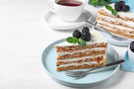 Tasty cake with berries on white wooden tableの写真素材