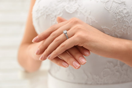 Young bride wearing beautiful engagement ring, closeupの写真素材