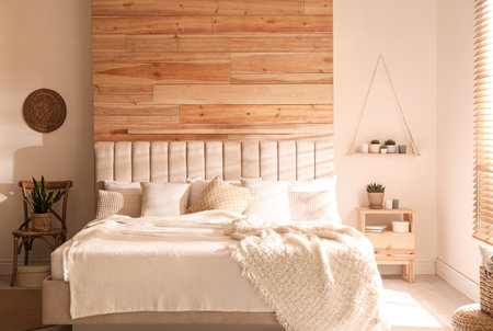 Stylish room interior with big comfortable bedの写真素材