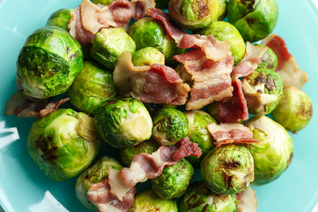 Delicious Brussels sprouts with bacon on plate, closeupの写真素材