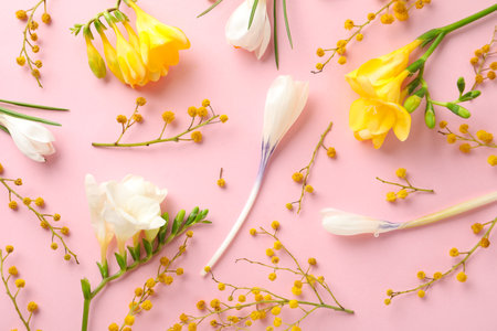 Flat lay composition with spring flowers on pink backgroundの写真素材