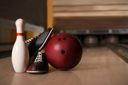 Pin, shoes and ball on alley in bowling clubの写真素材