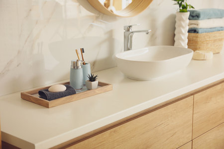 Countertop with sink and toiletries in the bathroom. interior designの写真素材