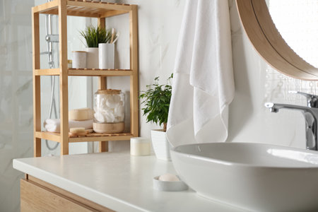 Shelving unit with toiletries in bathroom interiorの写真素材