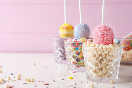Egg shaped cake pops on white wooden table, space for text. easter celebrationの写真素材