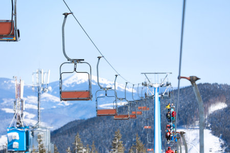 Empty chairlift at mountain ski resort. winter holidaysの写真素材