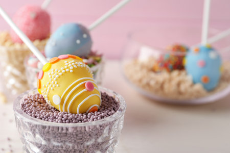 Egg shaped cake pop on table, closeup with space for text. easter celebration