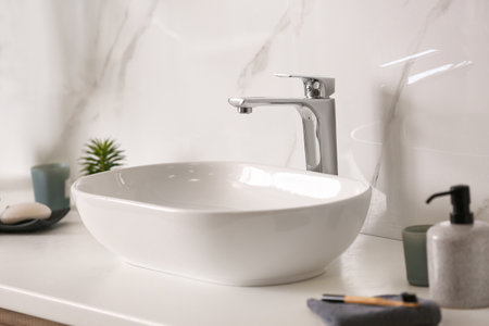 Stylish vessel sink on light countertop in modern bathroomの写真素材