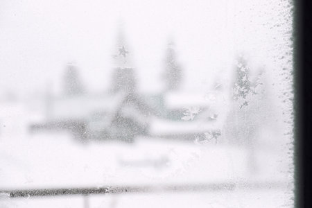 Beautiful frosty pattern on window glass. winter morningの写真素材