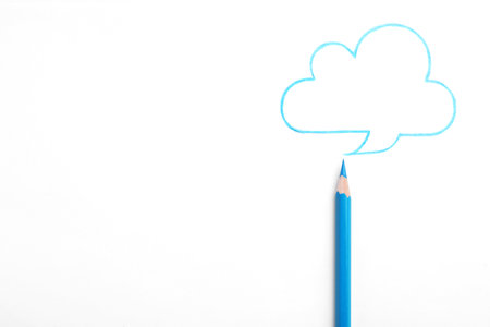 Drawing of cloud and light blue pencil on white background, top viewの写真素材
