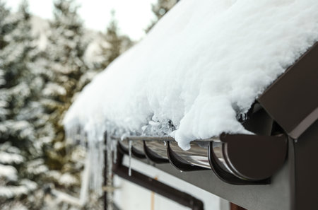 House roof covered with snow outdoors, closeup. winter holidaysの写真素材