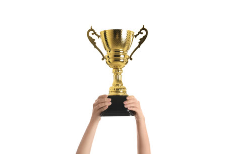 Woman holding gold trophy cup on white background, closeupの写真素材