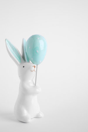 Bunny ceramic figure as Easter decor on white backgroundの写真素材