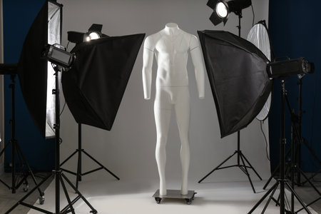 Ghost mannequin and professional lighting equipment in modern photo studioの写真素材