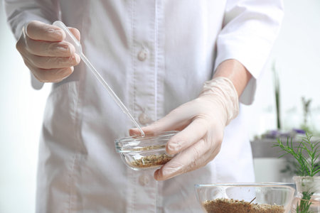 Scientist developing cosmetic product in laboratory, closeup
