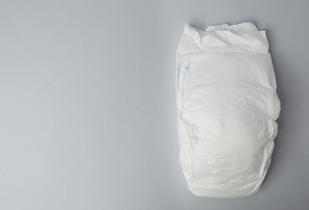 Baby diaper on gray background, top view. Space for textの写真素材