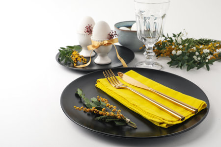 Festive Easter table setting with beautiful floral decorの写真素材