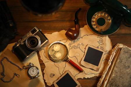 Flat lay composition with vintage detective items on wooden tableの写真素材