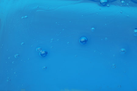 Sample of blue cosmetic gel as background, closeup