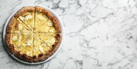 Tasty cheese pizza on white marble table, top view. Space for text