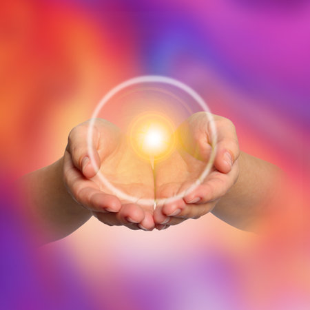 Woman holding concentrated healing energy in her hands, closeupの写真素材