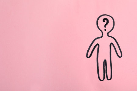 Picture of human figure with question mark in head on pink background, top view. Space for textの写真素材