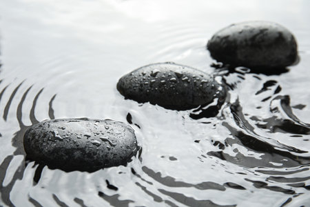 Spa stones in water, closeup. Zen lifestyleの写真素材
