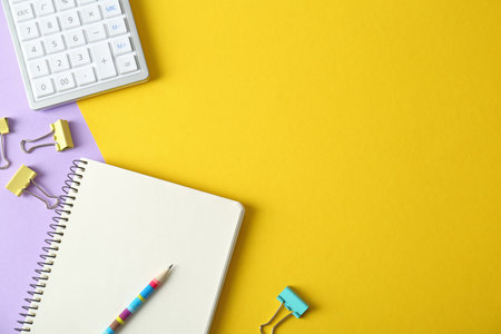 Flat lay composition with stationery on yellow background, space for text. Doing houseworkの写真素材