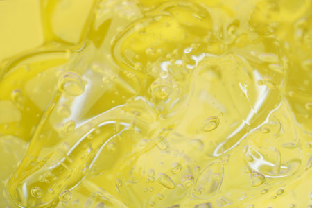 Pure transparent cosmetic gel on yellow background, closeupの写真素材