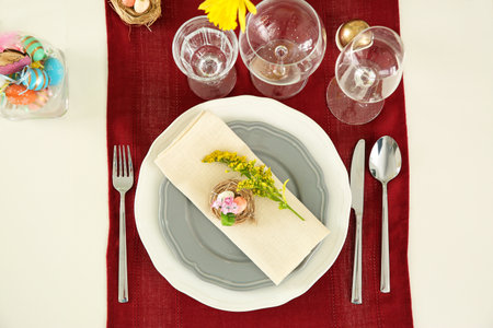 Festive Easter table setting with floral decor, flat lay