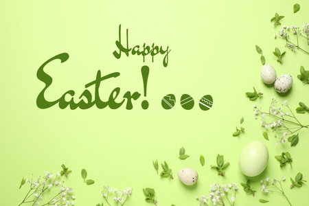 Flat lay composition with eggs and text Happy Easter on light green backgroundの写真素材