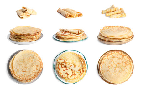 Set of delicious thin pancakes on white backgroundの写真素材