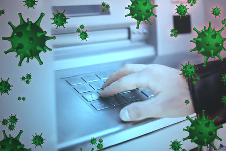 Use cash machine carefully during virus outbreak. Man withdrawing money at ATM